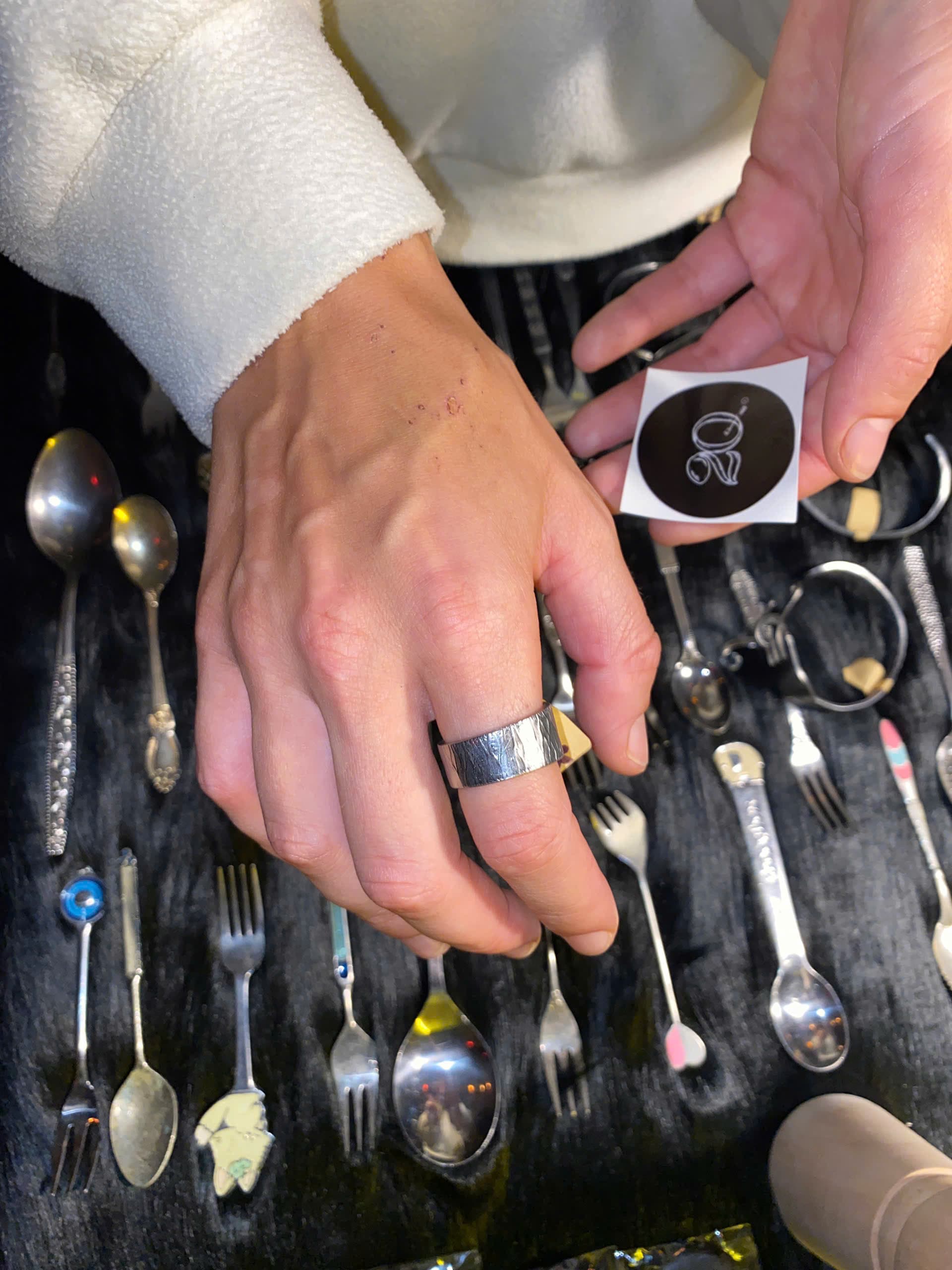 Customer choosing a vintage spoon to be crafted into a ring by 2Q Nhẫn Thuật
